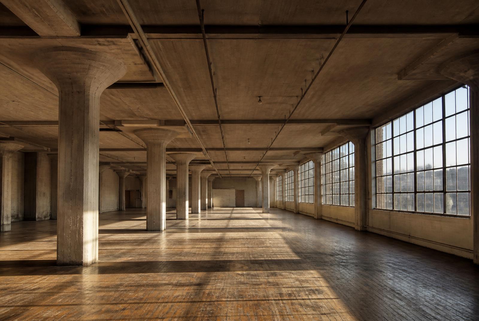 Brooklyn Army Terminal loft interior — concrete columns and steel-sash windows